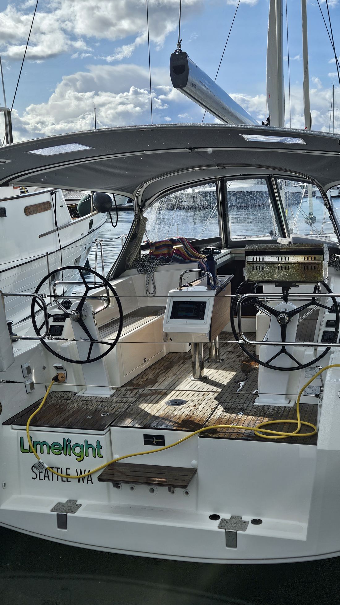 Limelight's cockpit with twin wheels, bimini and instruments