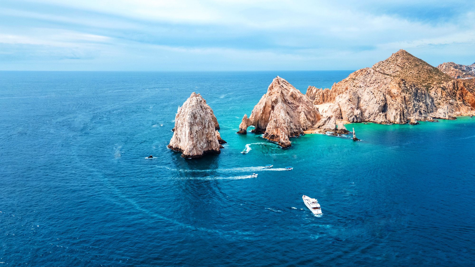 Aerial view of Land's End at Cabo San Lucas, boats heading out into open water